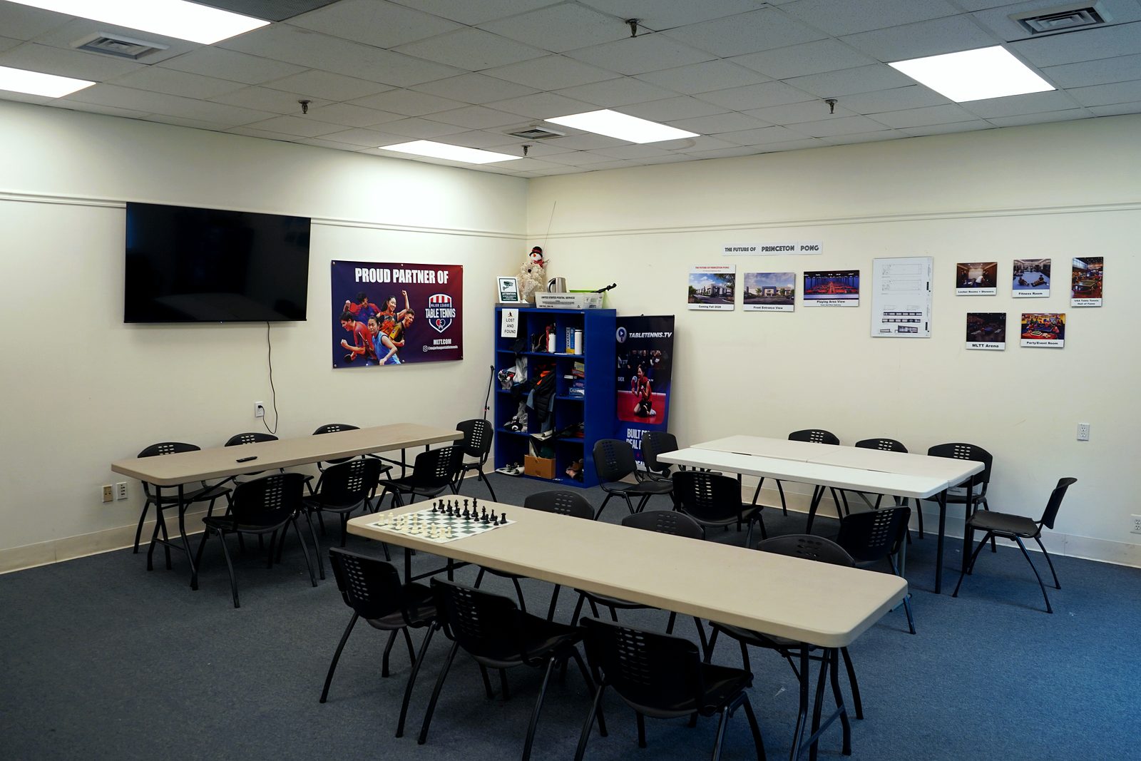 Party and event room set up with tables, chairs, and a chess board