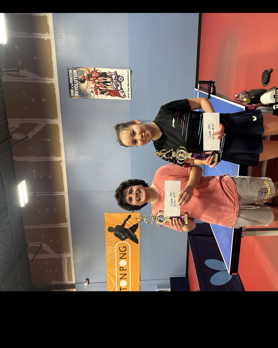 Under 1800 division winners holding their trophies and prize envelopes at Princeton Pong